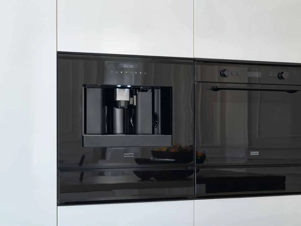 Franke coffee machine and oven installed together in matching black finish